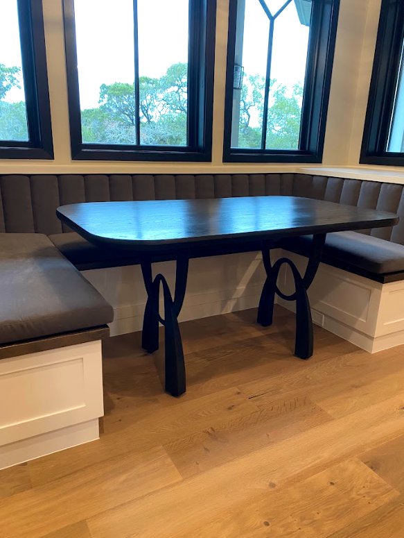 Lockwood Table — Ebonized oak · curved loop legs
